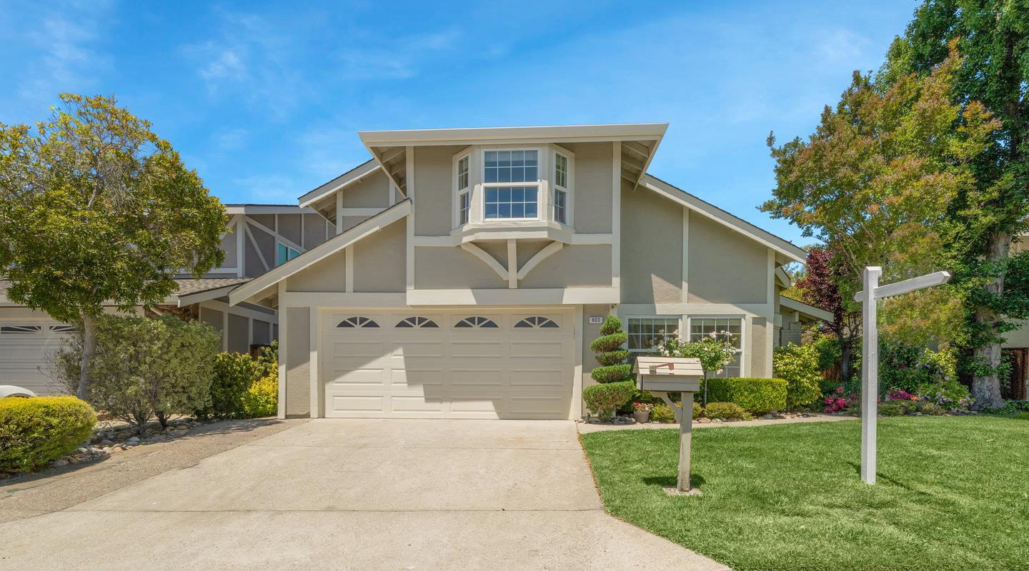 front view of a house with a yard