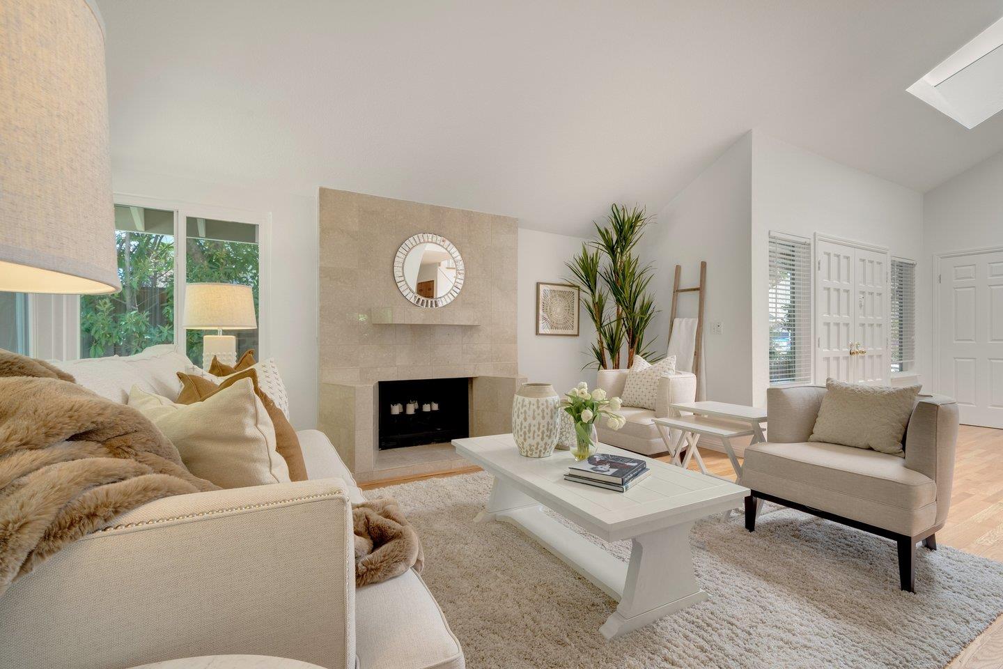 603 Cornwallis Lane Foster City, CA 94404 - Photo 2 of 36 a living room with furniture and a fireplace