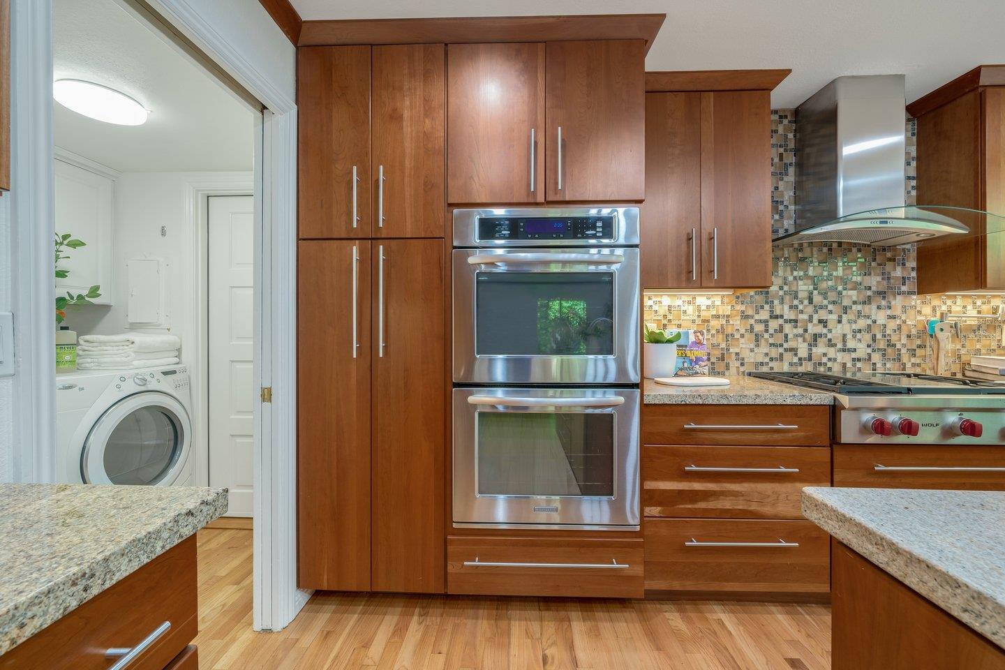 603 Cornwallis Lane Foster City, CA 94404 - Photo 12 of 36 a kitchen with stainless steel appliances granite countertop a stove and a refrigerator