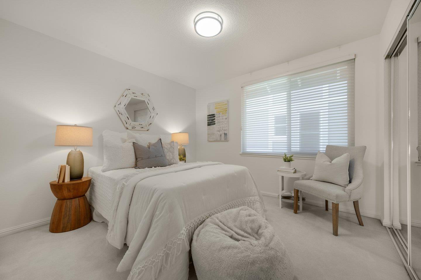 603 Cornwallis Lane Foster City, CA 94404 - Photo 25 of 36 a bedroom with a bed and a chandelier