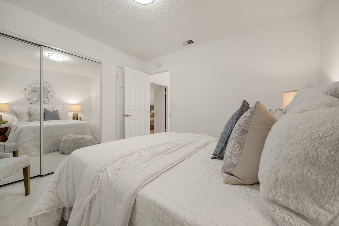 603 Cornwallis Lane Foster City, CA 94404 - Photo 26 of 36 a bedroom with a bed and with large mirror