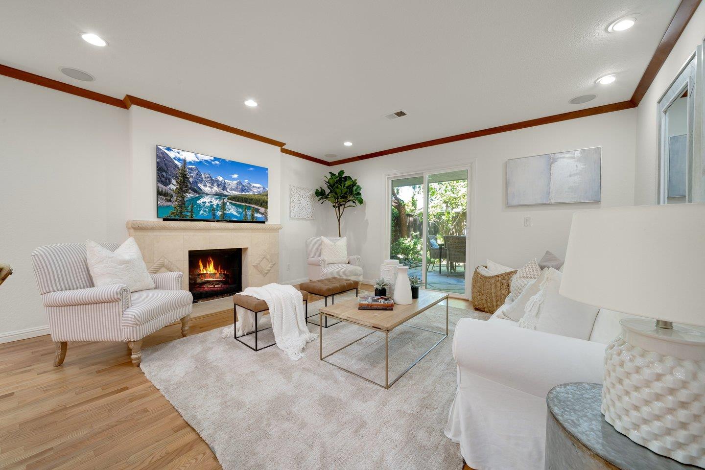 603 Cornwallis Lane Foster City, CA 94404 - Photo 7 of 36 a living room with furniture a fireplace and a flat screen tv