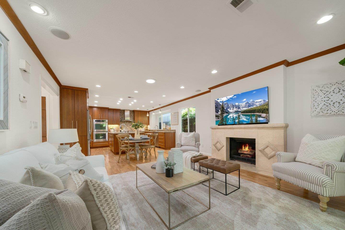 603 Cornwallis Lane Foster City, CA 94404 - Photo 8 of 36 a living room with furniture and a fireplace