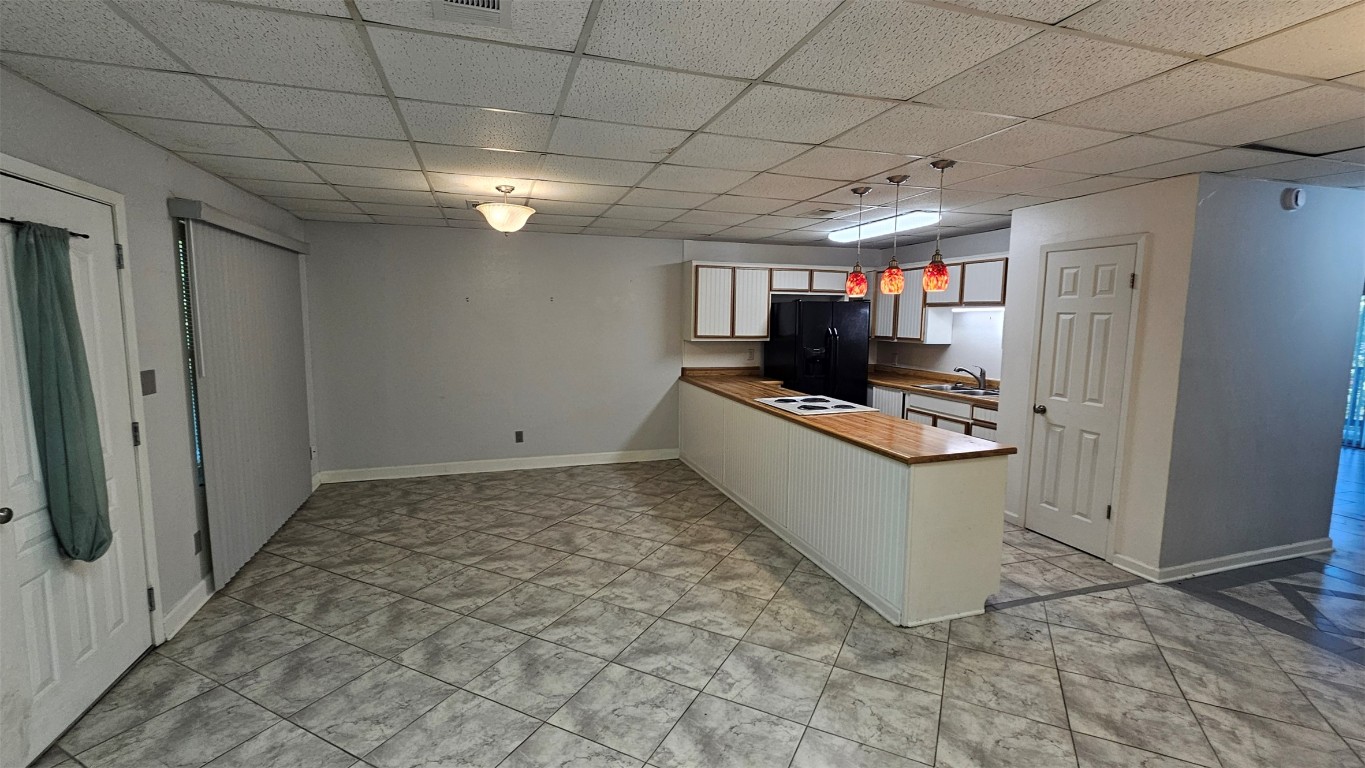170 Interstate Drive, Unit B Buda, TX 78610 - Photo 3 of 11 a view of a storage & utility room in a kitchen