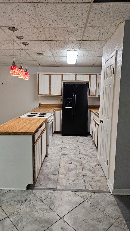 170 Interstate Drive, Unit B Buda, TX 78610 - Photo 4 of 11 a kitchen with granite countertop lots of counter top space and refrigerator