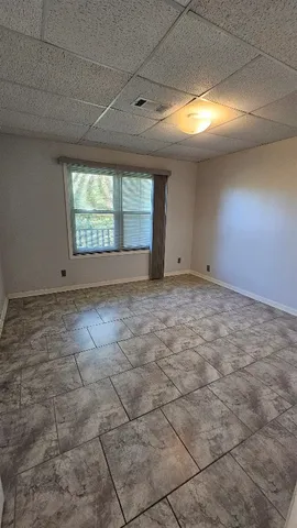 a view of an empty room and window