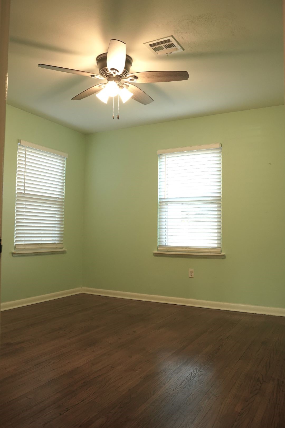 1202 Mac Drive Sweeny, TX 77480 - Photo 9 of 12 a view of a room with wooden floor and windows
