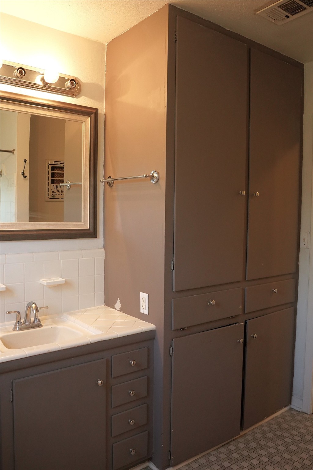 1202 Mac Drive Sweeny, TX 77480 - Photo 10 of 12 a bathroom with a sink and mirror