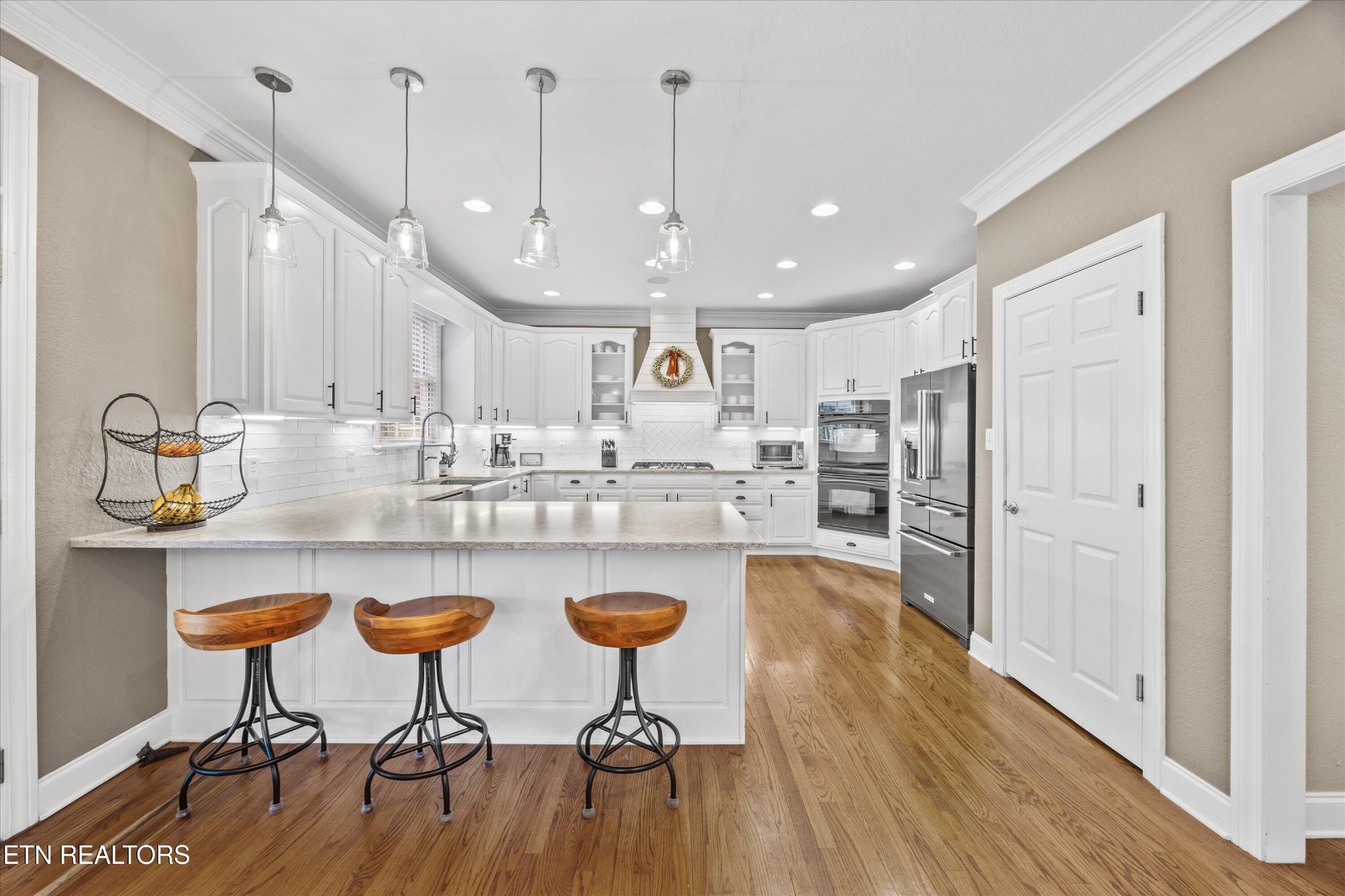 12820 High Oak Road Knoxville, TN 37934 - Photo 13 of 60 a kitchen with stainless steel appliances granite countertop a dining table chairs sink refrigerator and microwave