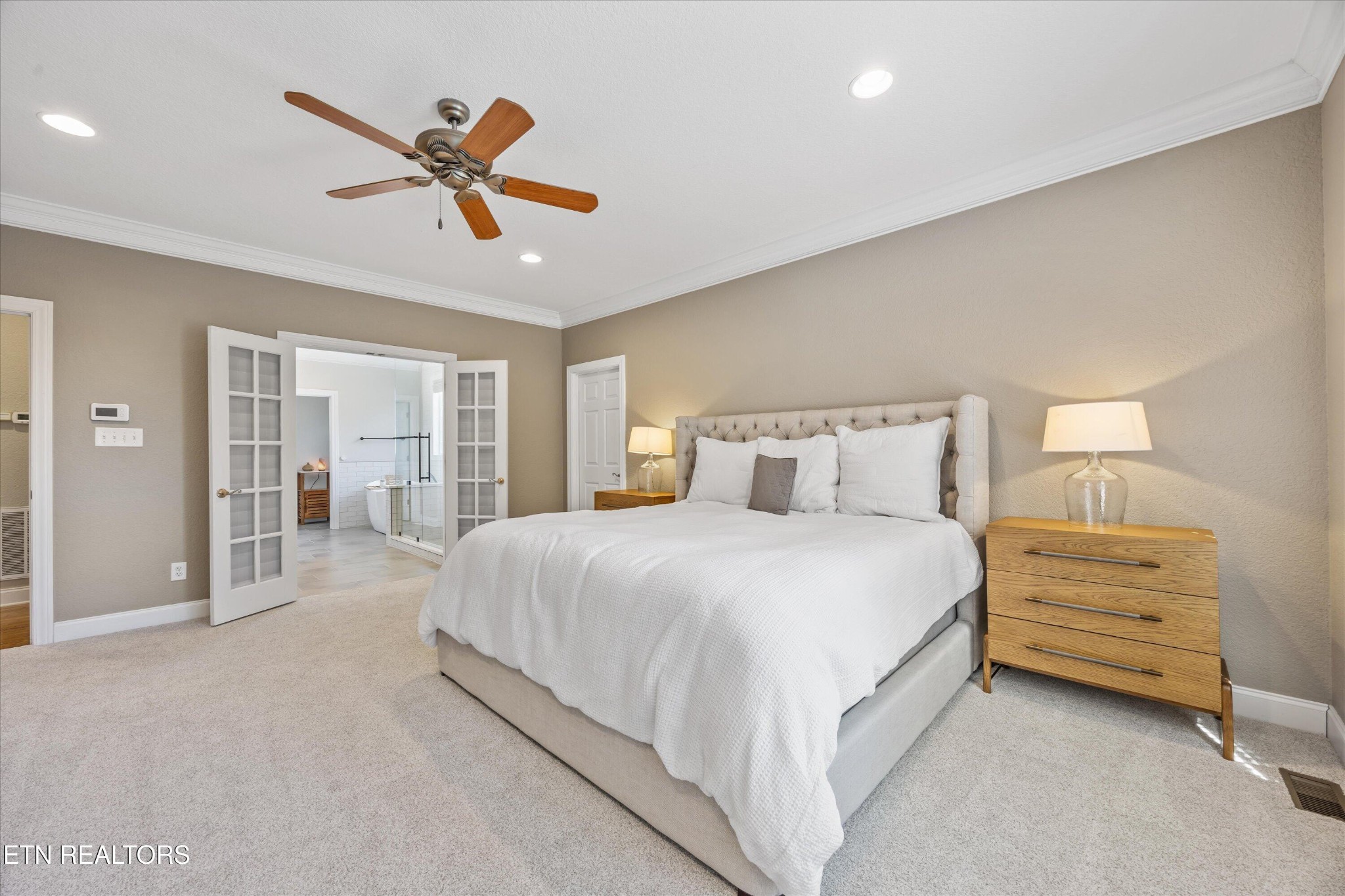 12820 High Oak Road Knoxville, TN 37934 - Photo 15 of 60 a spacious bedroom with a bed and large mirror