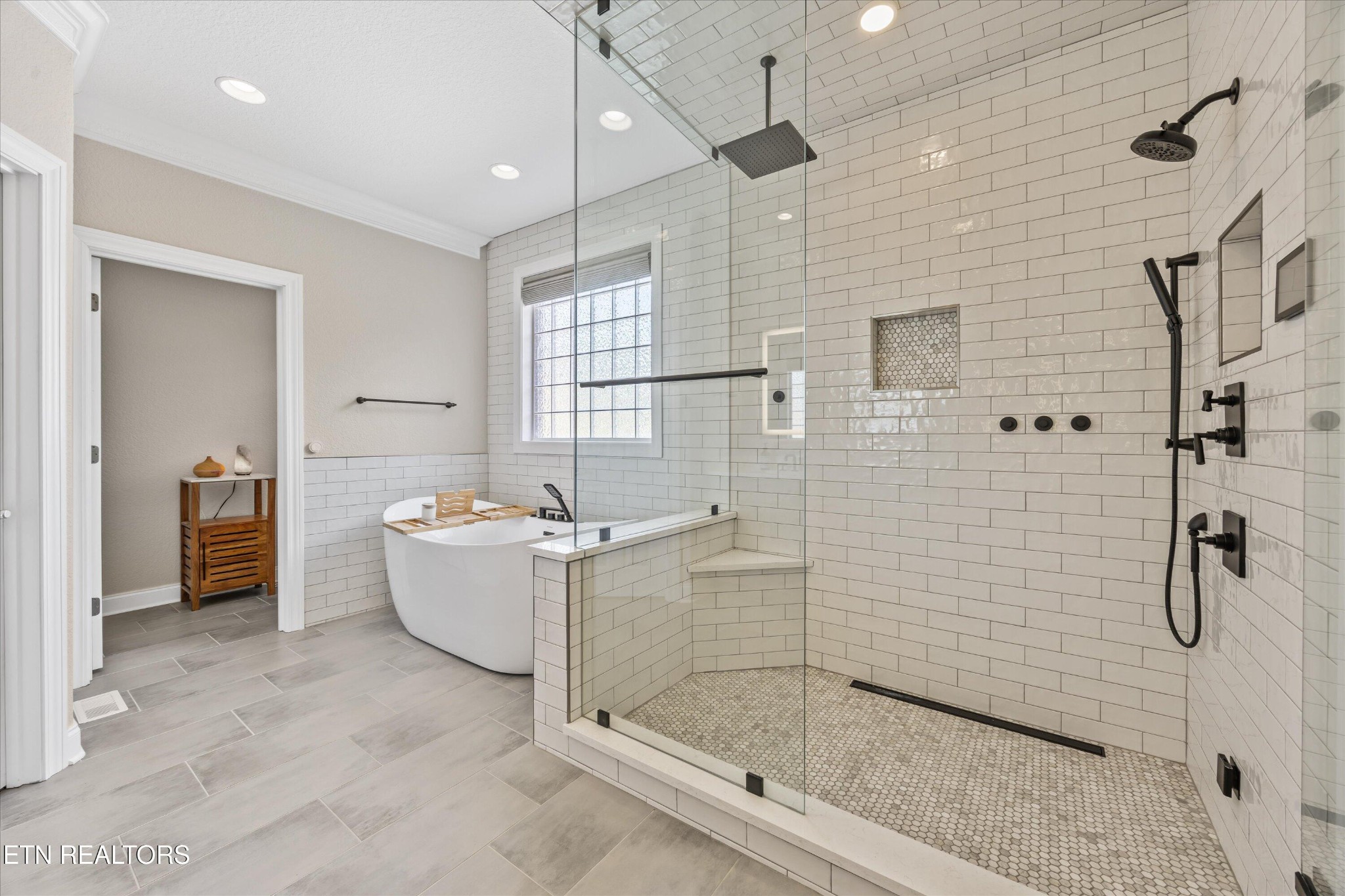 12820 High Oak Road Knoxville, TN 37934 - Photo 18 of 60 a bathroom with a bathtub and shower