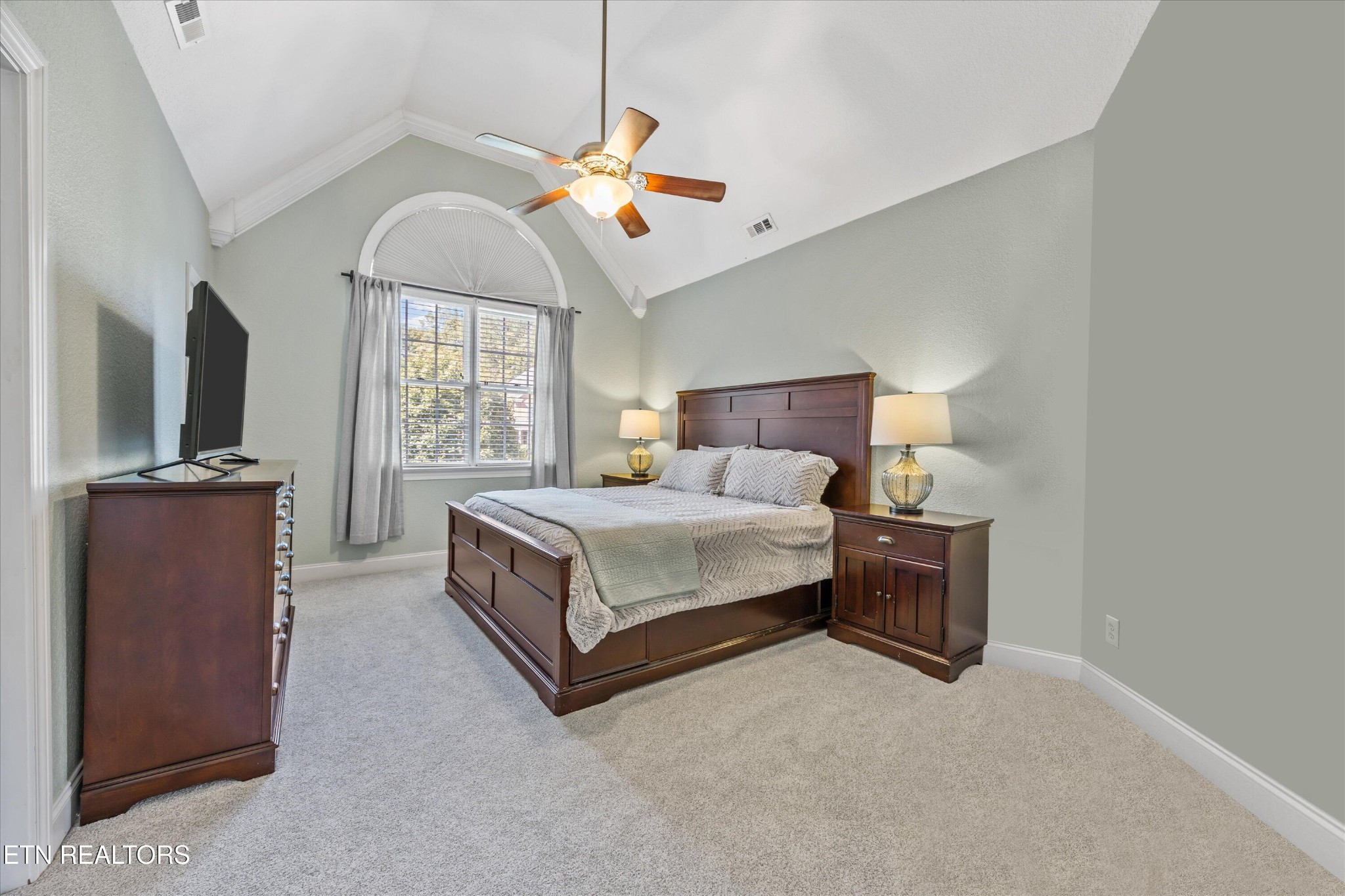 12820 High Oak Road Knoxville, TN 37934 - Photo 24 of 60 a spacious bedroom with a bed and a flat screen tv