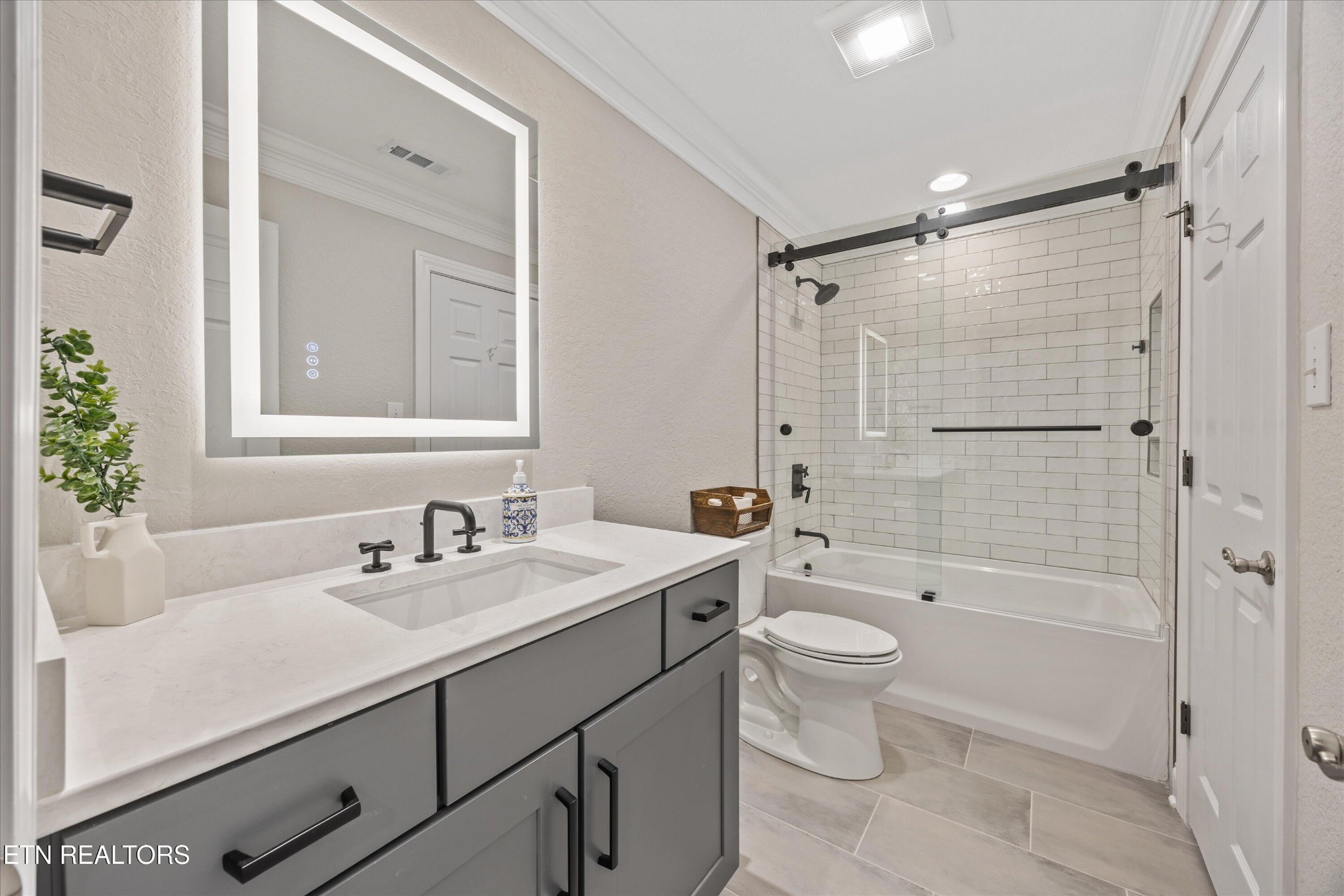 12820 High Oak Road Knoxville, TN 37934 - Photo 25 of 60 a bathroom with a sink a toilet and shower