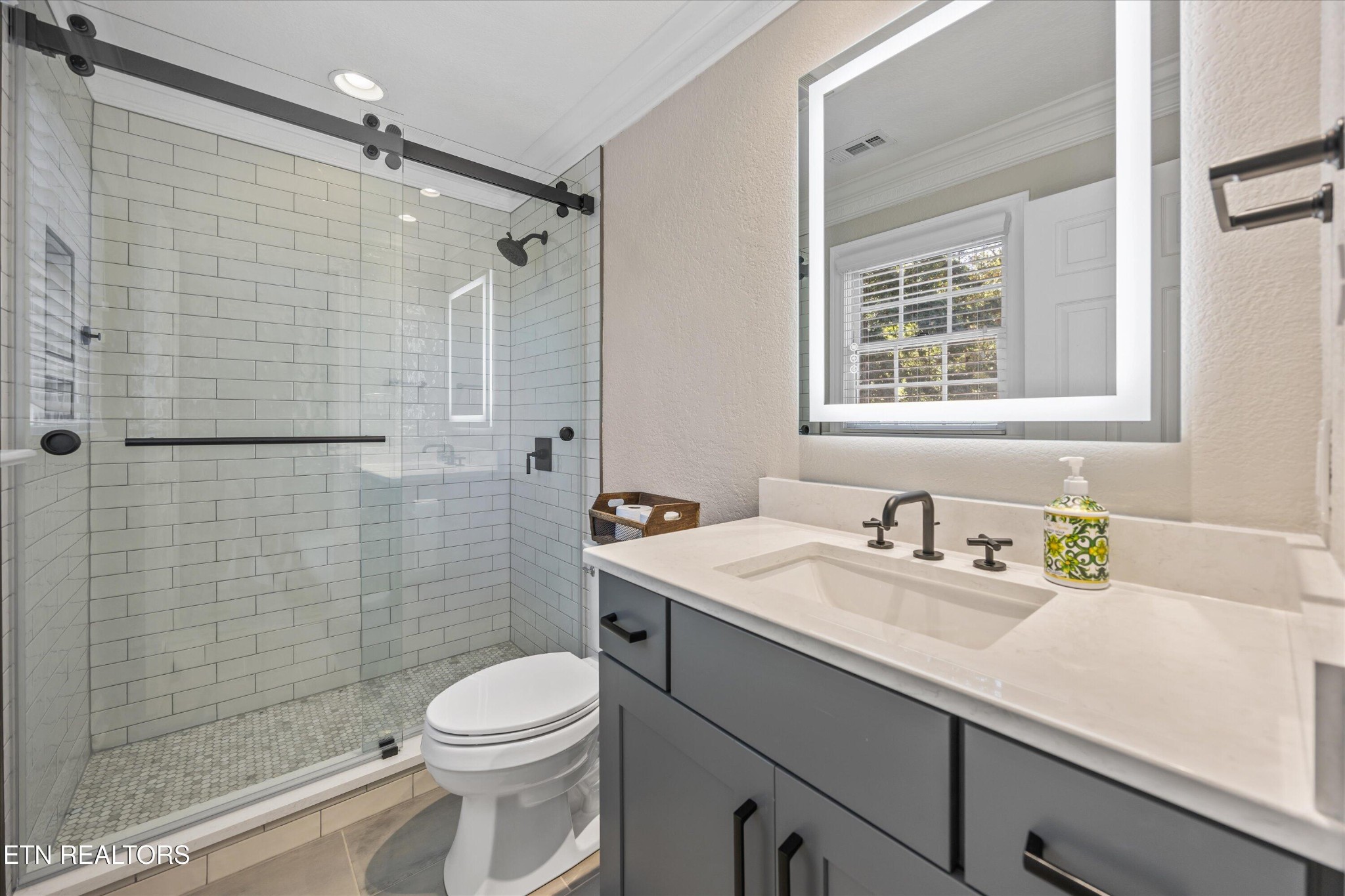 12820 High Oak Road Knoxville, TN 37934 - Photo 30 of 60 a bathroom with a sink a toilet and shower