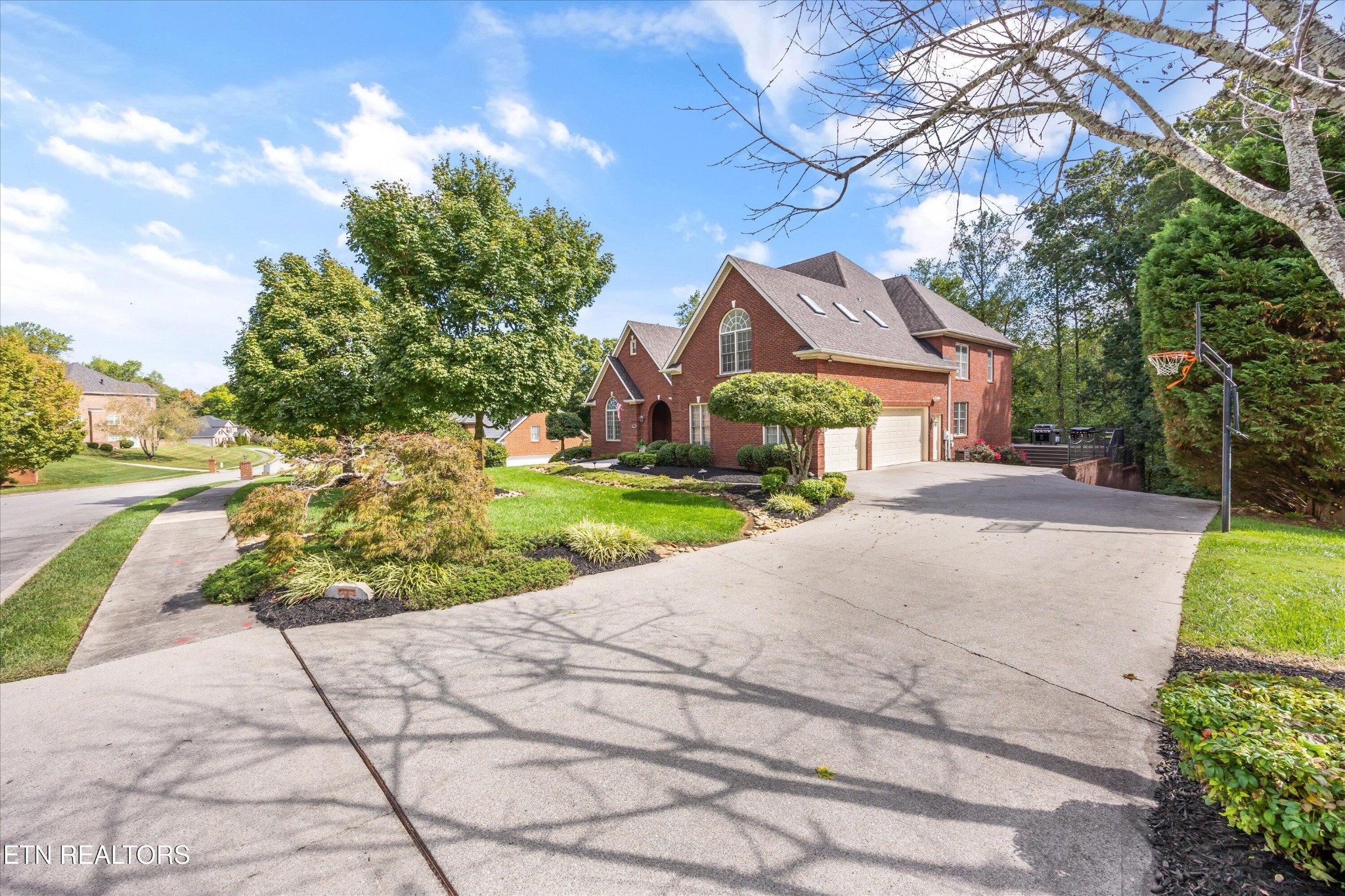12820 High Oak Road Knoxville, TN 37934 - Photo 54 of 60 a front view of a house with a yard and garage