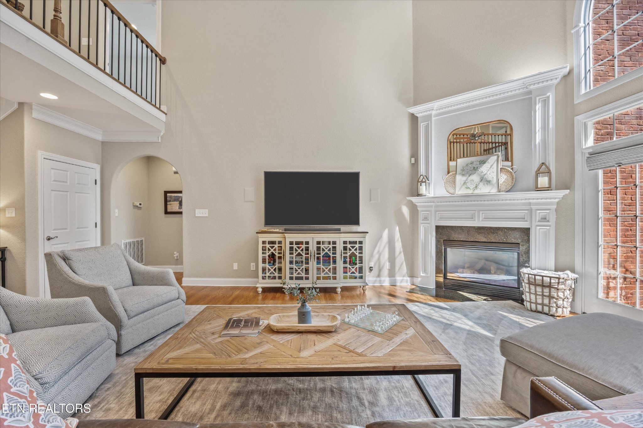 12820 High Oak Road Knoxville, TN 37934 - Photo 8 of 60 a living room with furniture a flat screen tv and a fireplace