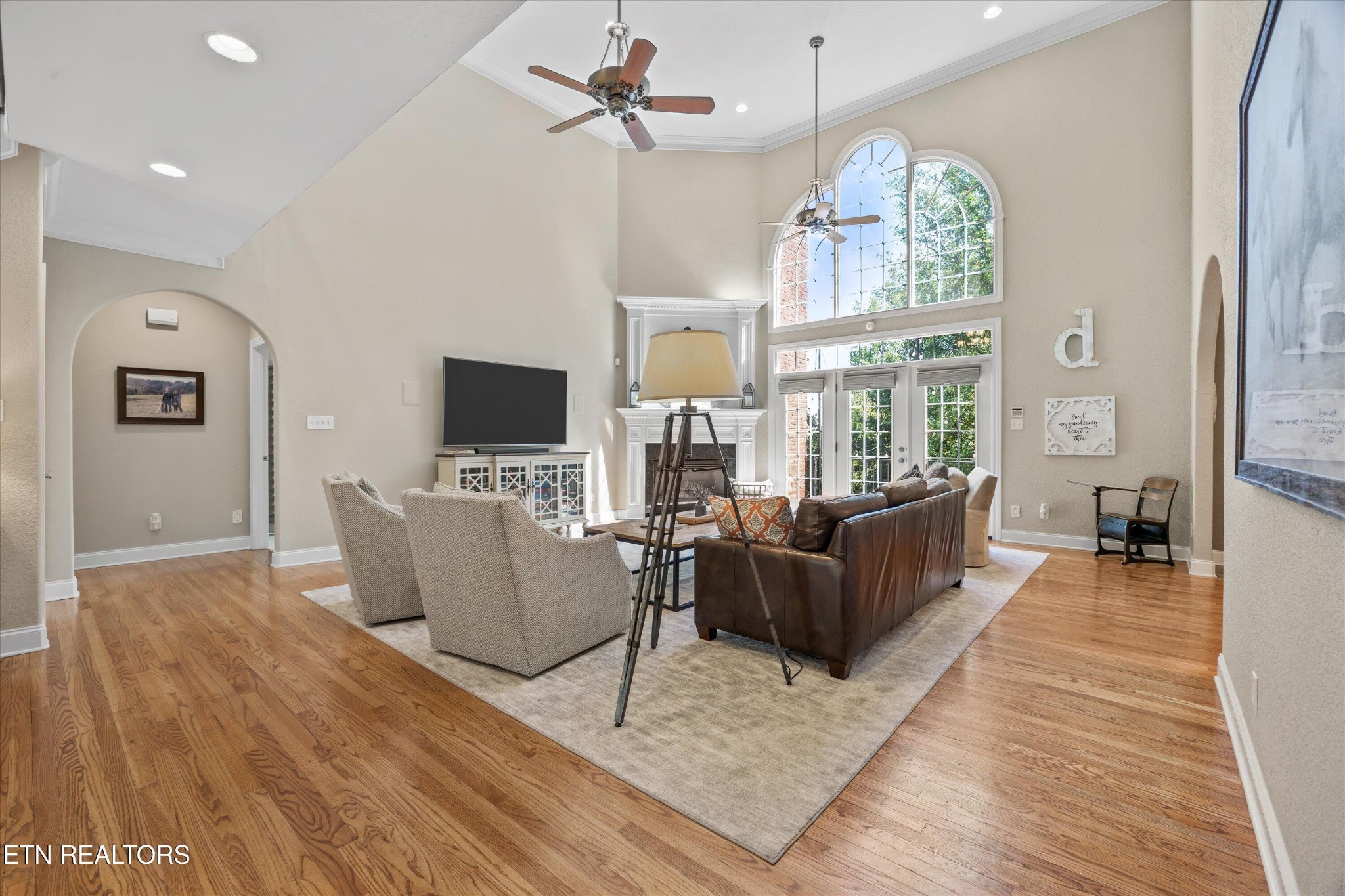 12820 High Oak Road Knoxville, TN 37934 - Photo 10 of 60 a living room with furniture a flat screen tv and a large window