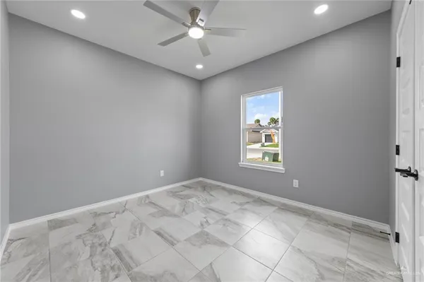 a view of an empty room with a window
