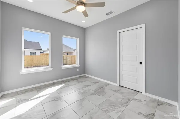 a view of an empty room with a window