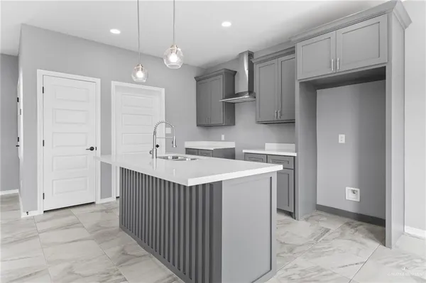 a kitchen with a sink stove and refrigerator