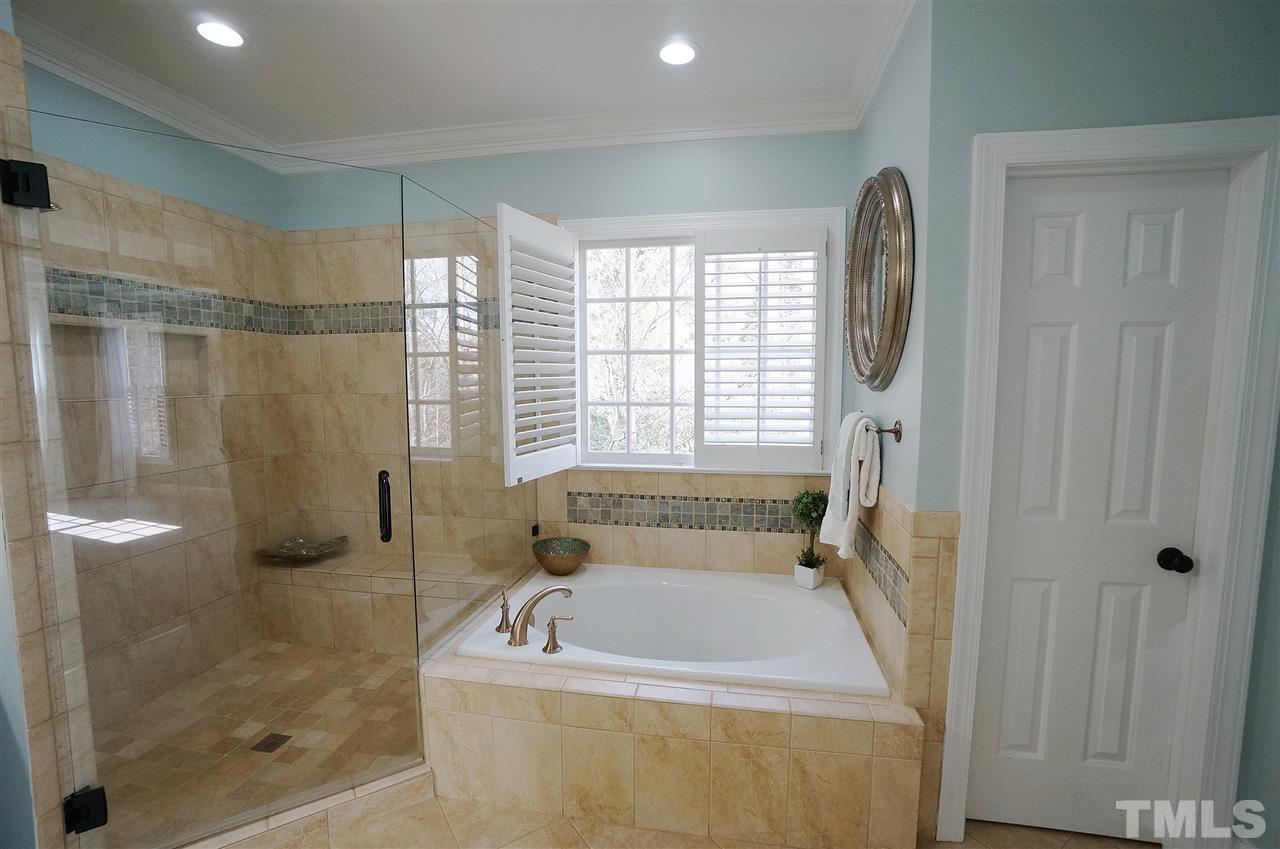 204 Veranda Court Raleigh, NC 27615 - Photo 14 of 25 Bright & Spacious Layout. Garden Tub. Walk in Shower. Tile detail.
