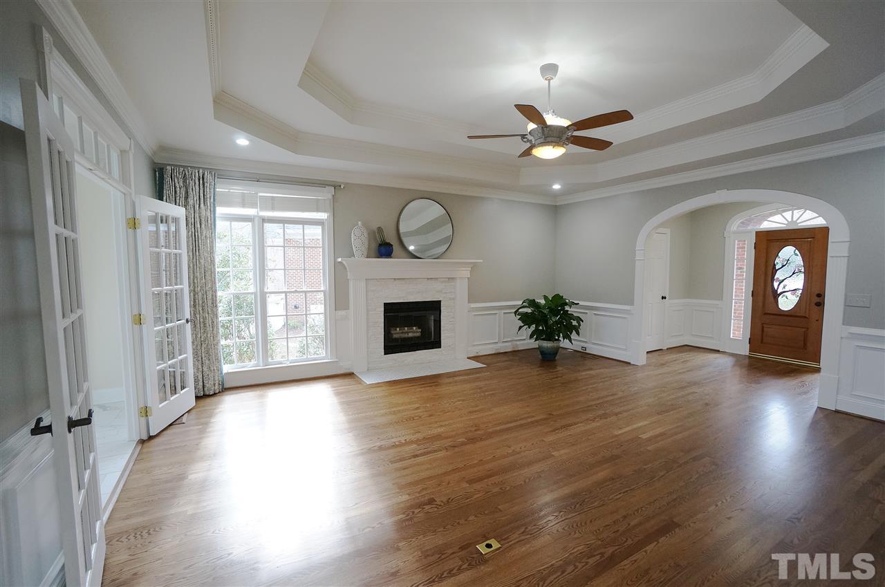 204 Veranda Court Raleigh, NC 27615 - Photo 3 of 25 Trey ceiling. Gorgeous Fireplace. Arched Doorways.