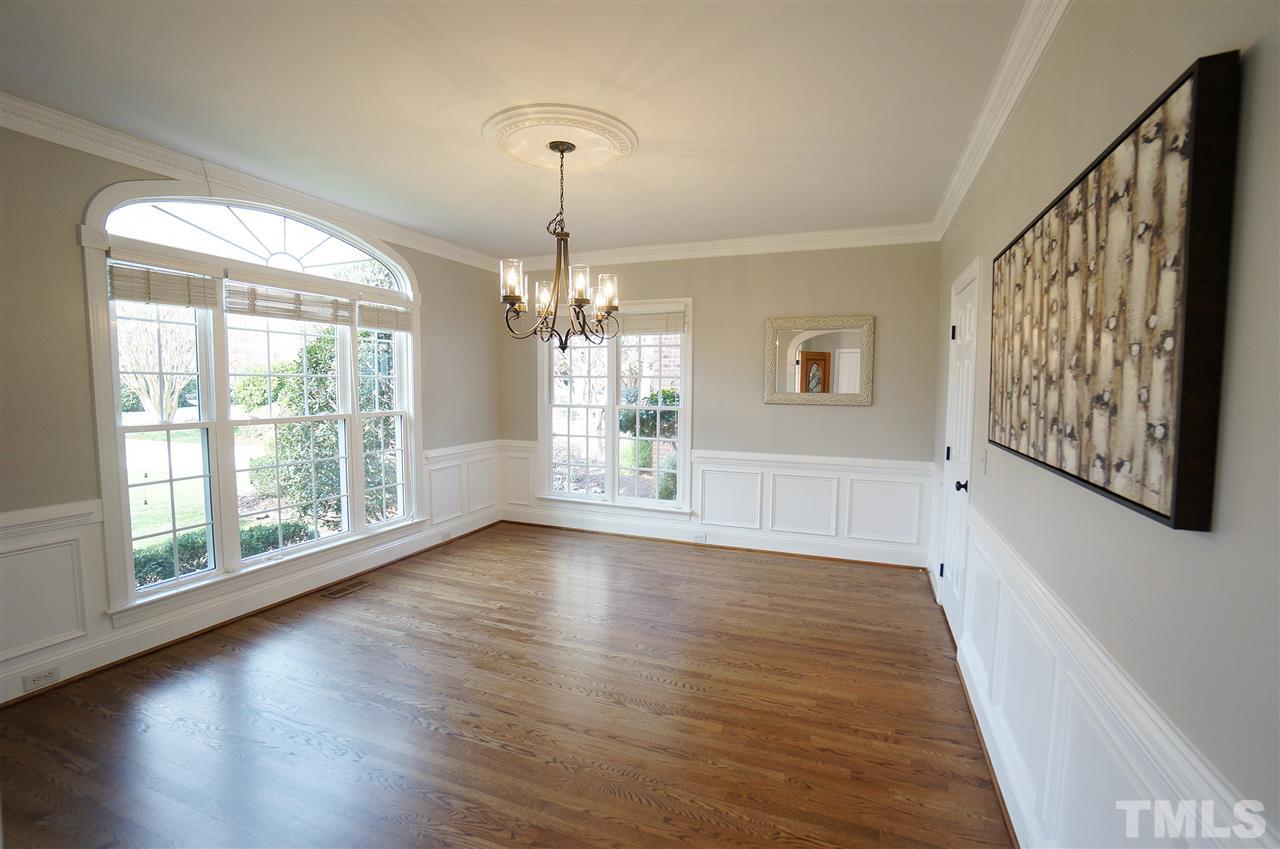 204 Veranda Court Raleigh, NC 27615 - Photo 4 of 25 Crown Molding. Wainscoting. Arched window. Beautiful Natural Lighting.