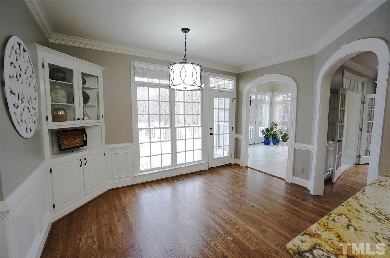 204 Veranda Court Raleigh, NC 27615 - Photo 8 of 25 Built in corner storage & Display. Arched doorways to Sun Rm & Living Rm. Transom Windows.