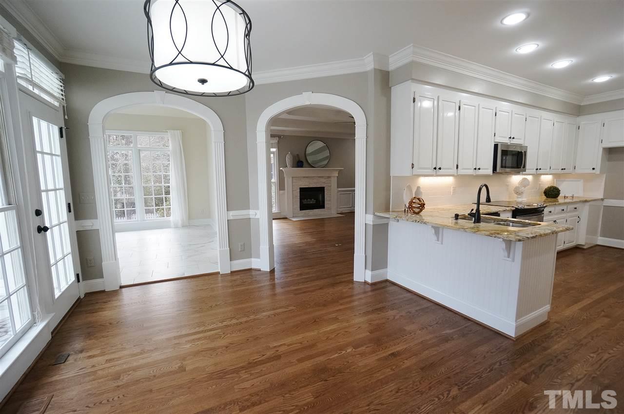 204 Veranda Court Raleigh, NC 27615 - Photo 9 of 25 Built in corner storage & Display. Arched doorways to Sun Rm & Living Rm. Transom Windows.