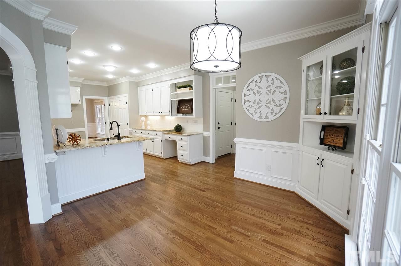 204 Veranda Court Raleigh, NC 27615 - Photo 10 of 25 Built in corner storage & Display. Arched doorways to Sun Rm & Living Rm. Transom Windows.