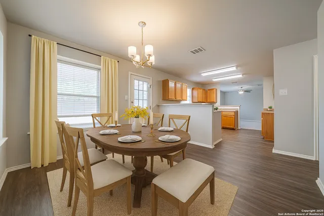 a view of a dining room with furniture and wooden floor