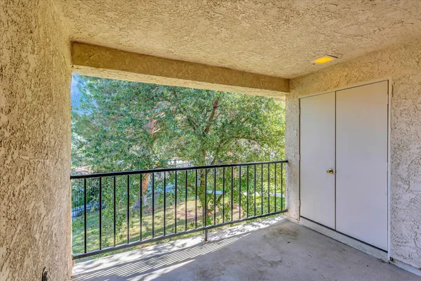 an empty room with sliding glass door