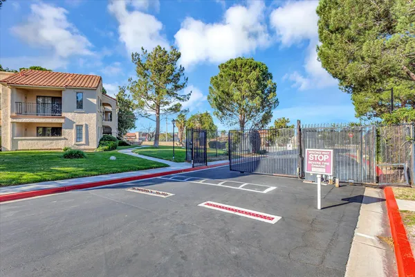 a front view of a house with basket ball court and outdoor seating