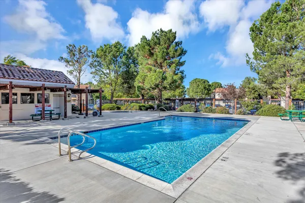 a view of a swimming pool with a patio