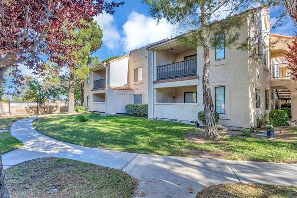 a view of a fountain in front of a house