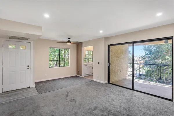 a view of an empty room with a window