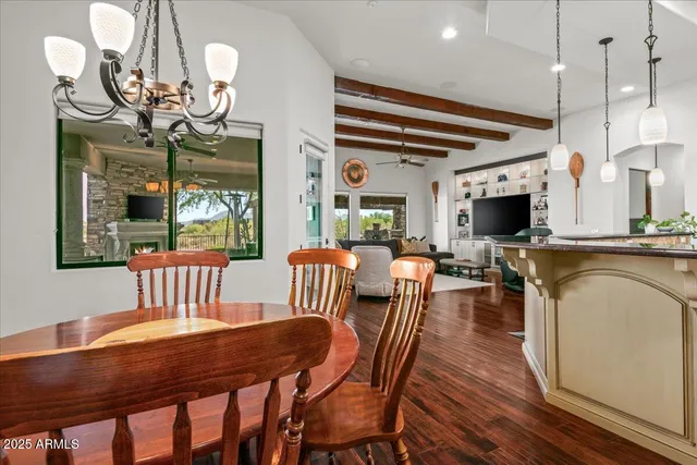 a bedroom with a bed and a flat screen tv on dresser