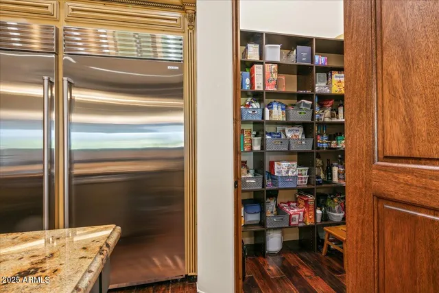 a front view of a house with a yard and a garage