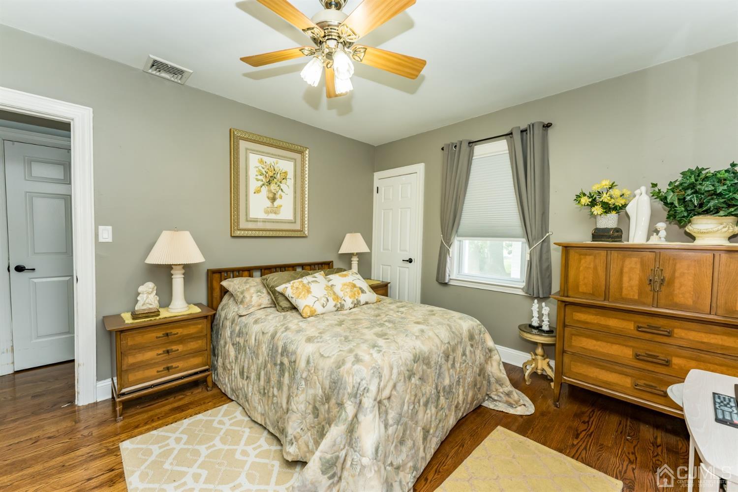 226 Hillside Road Linden, NJ 07036 - Photo 22 of 31 a bedroom with a bed and a chandelier