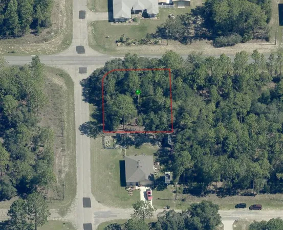 an aerial view of a house with outdoor space