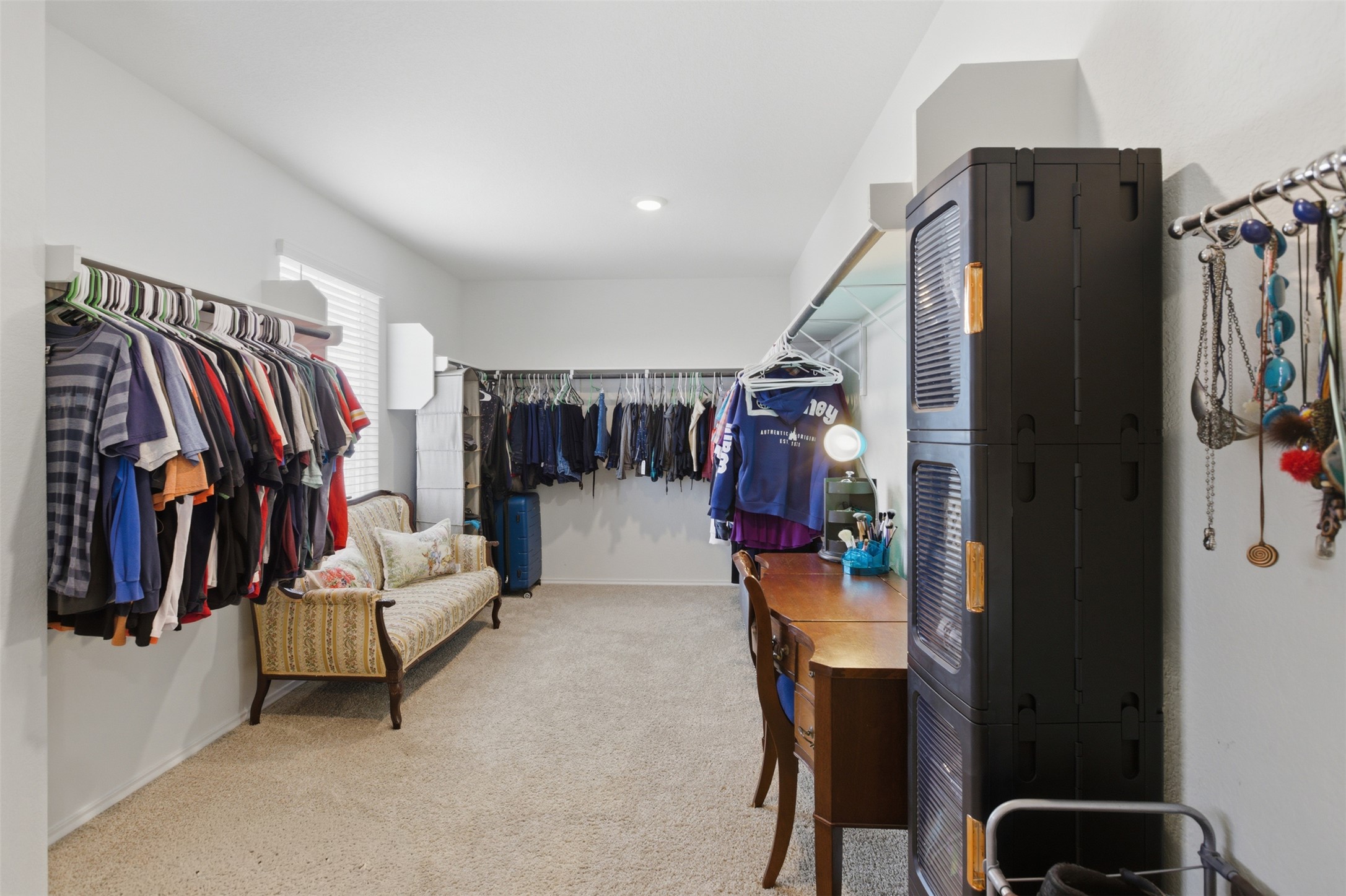 19017 Romano Drive Elgin, TX 78621 - Photo 29 of 33 Expansive room featuring wall-mounted clothing rods, soft carpet flooring, and recessed lighting