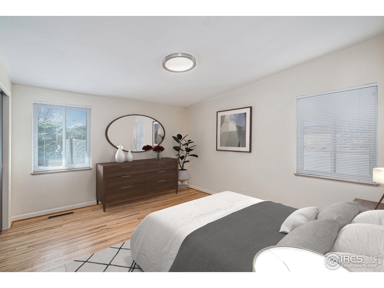 613 Skyline Drive Fort Collins, CO 80521 - Photo 11 of 19 a bedroom with bed and a window