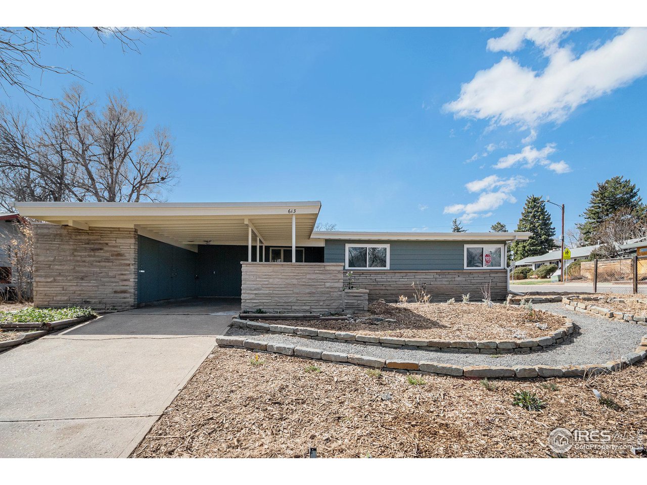 613 Skyline Drive Fort Collins, CO 80521 - Photo 16 of 19 a view of a house with a yard