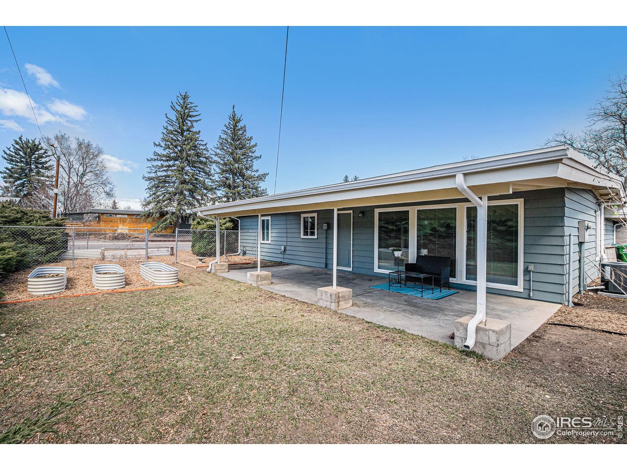 613 Skyline Drive Fort Collins, CO 80521 - Photo 17 of 19 a house view with a garden space