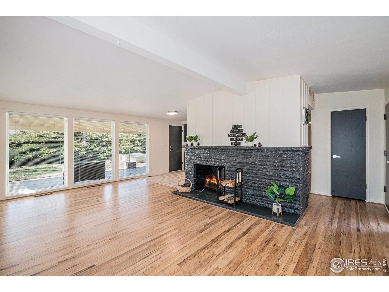 613 Skyline Drive Fort Collins, CO 80521 - Photo 2 of 19 a empty room with furniture and a fireplace