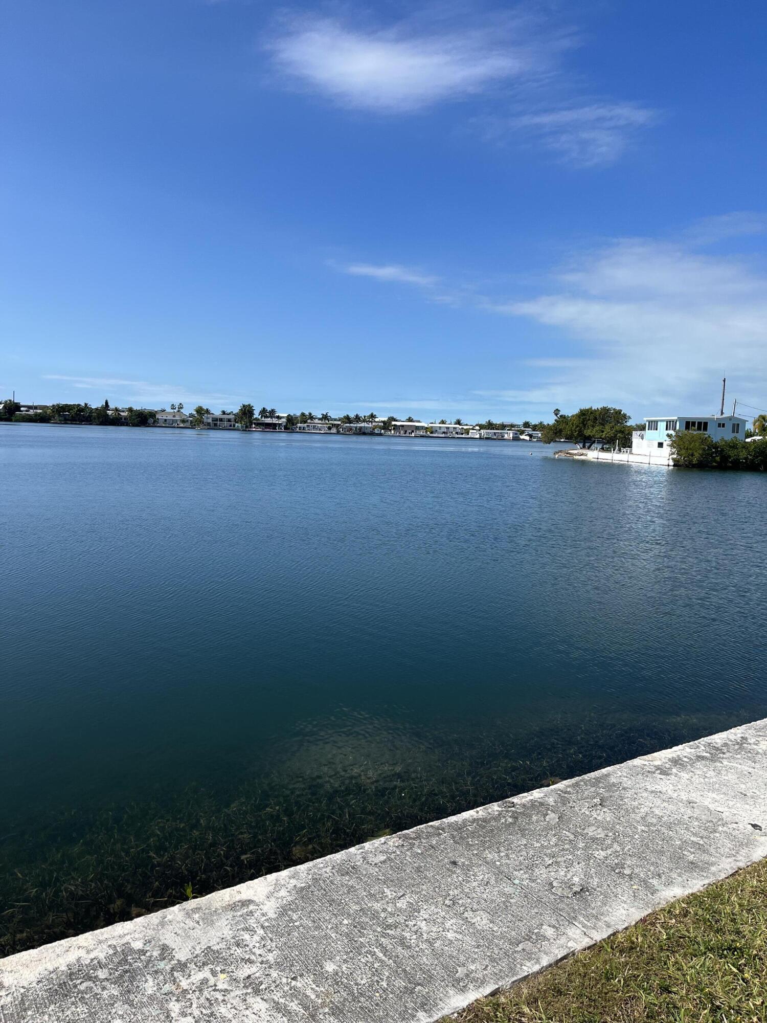 201 Coppitt Road, Unit 103B Key West, FL 33040 - Photo 8 of 9 a view of a lake from a yard