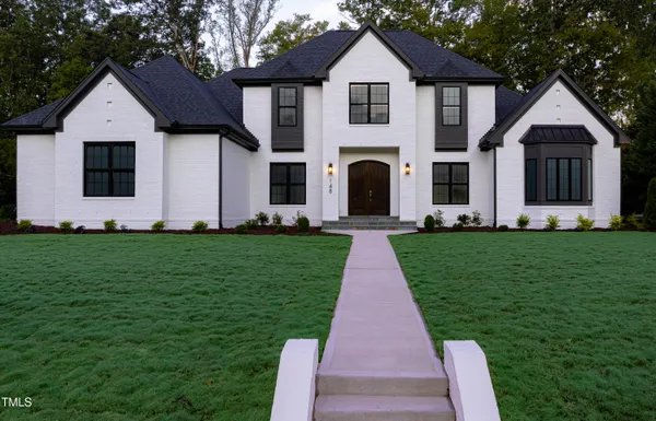 a front view of a house with a yard
