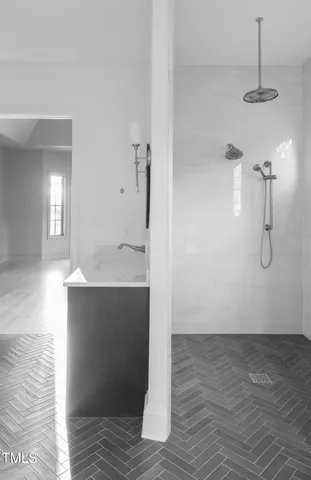 a view of a room with wooden floor and a window