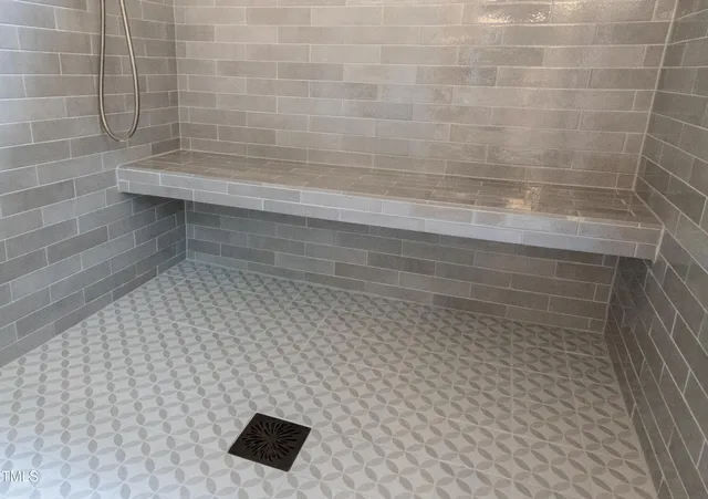 a view of a kitchen with a sink and cabinets