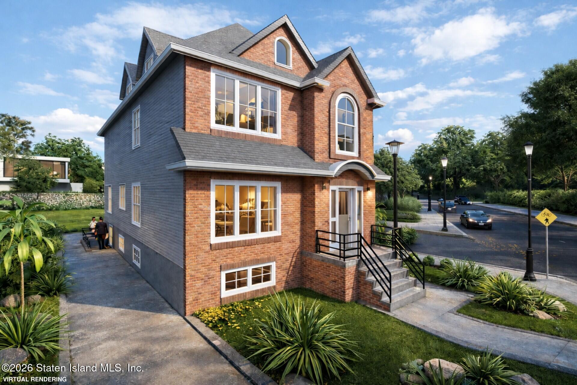 a front view of a house with a yard table and chairs